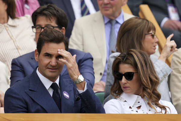 Roger Federer watches Djokovic from the Royal Box